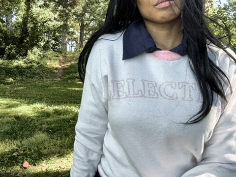 Anissa wearing The Selective Sweater outdoors over a navy collared shirt