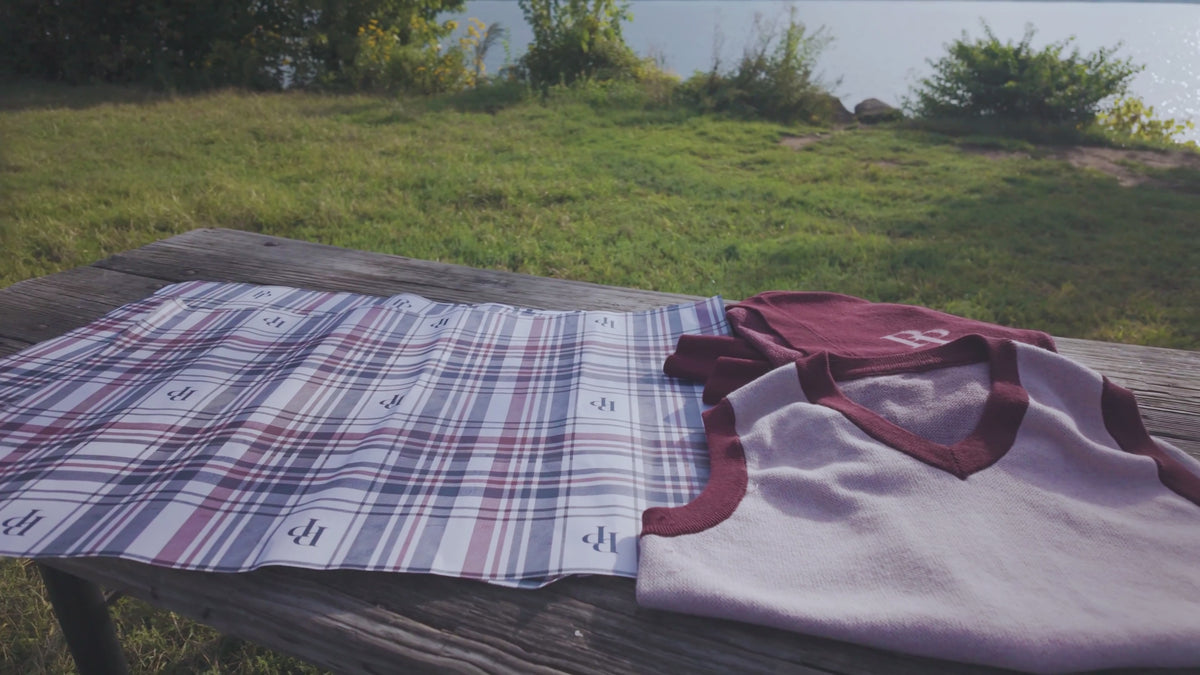 Preppy Picnic Sweaters: Strawberry & Plum sweater vest and Burgundy & Rose Pink cardigan on Public Prep plaid gift wrap by the water
