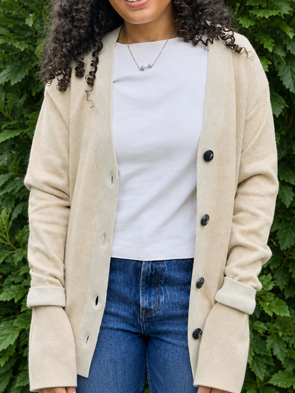 Anissa wearing the Public Prep Preppy Cardigan in Sand & Ivory outdoors