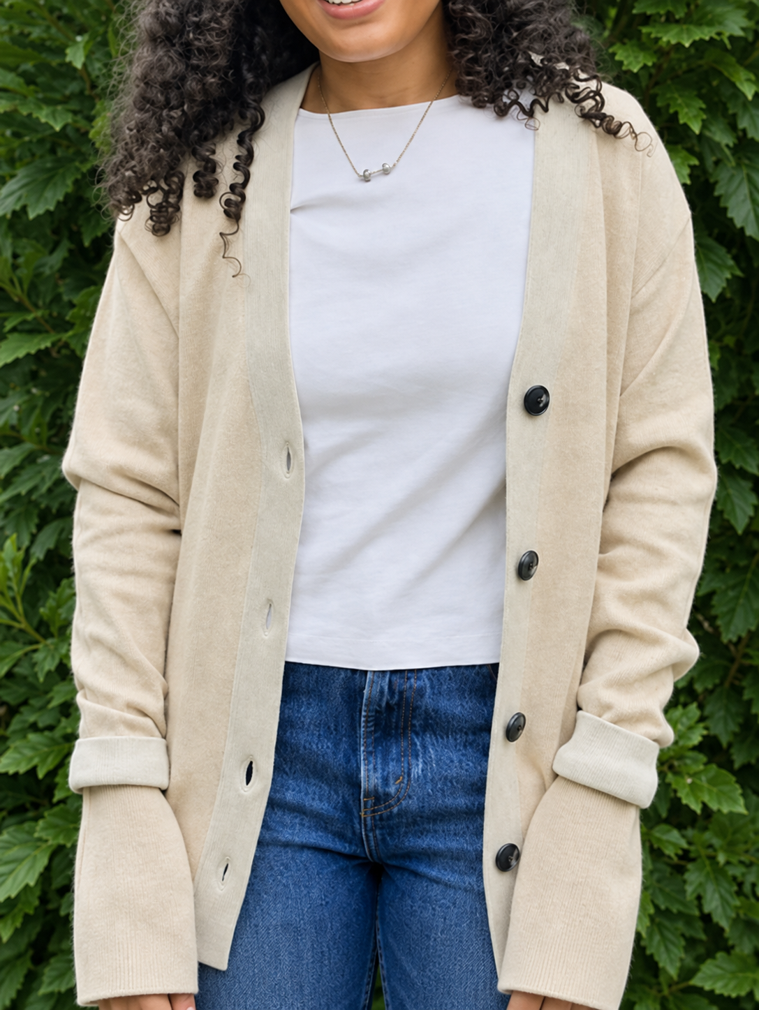 Anissa wearing the Public Prep Preppy Cardigan in Sand & Ivory outdoors