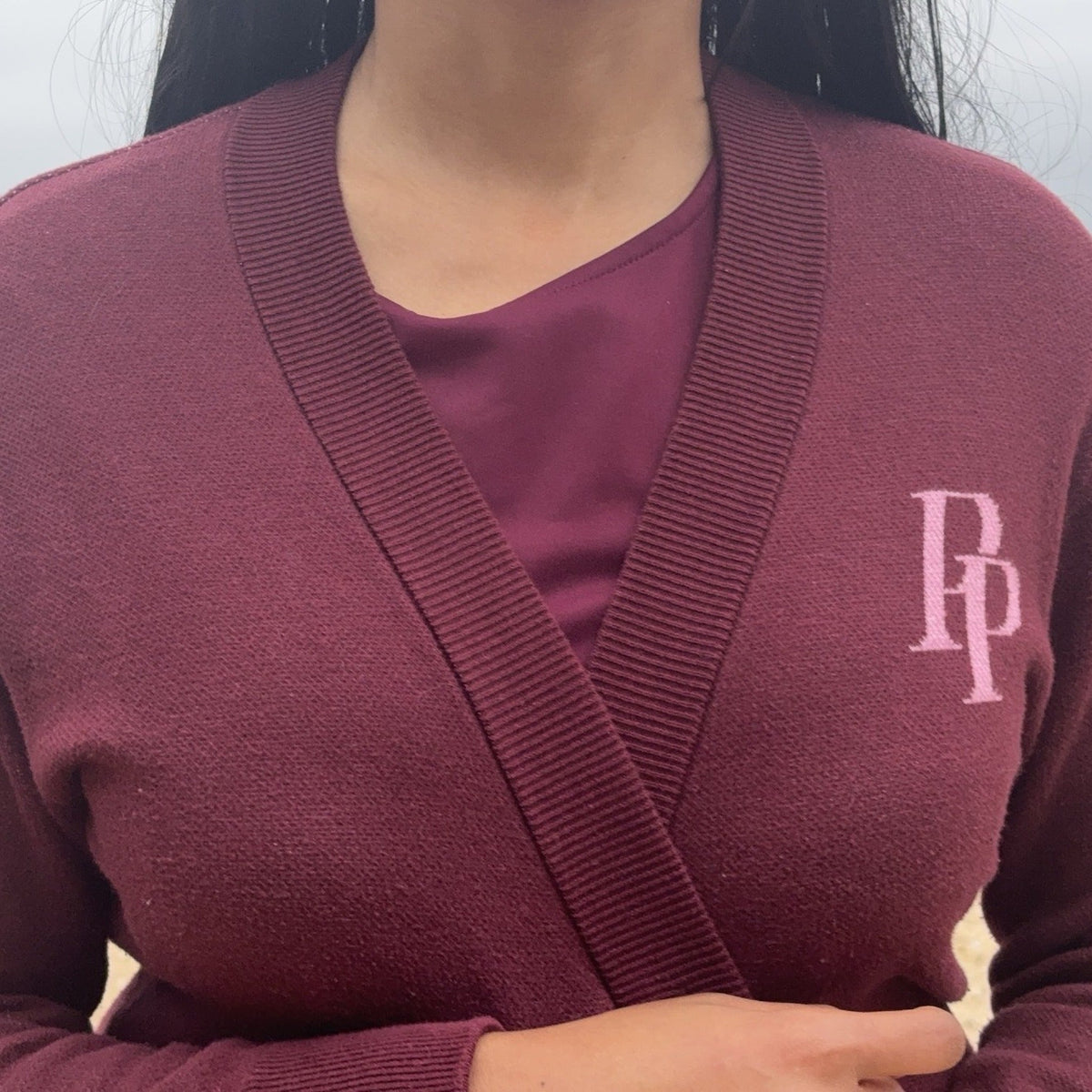 Burgundy and rose pink monogram cardigan layered over matching dress