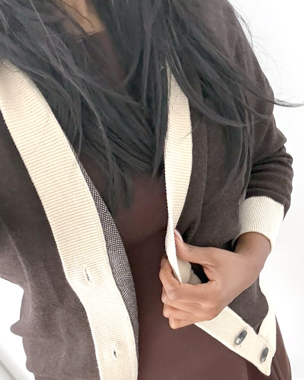 Anissa wearing the Public Prep Preppy Cardigan in Brown & Cream over a brown dress