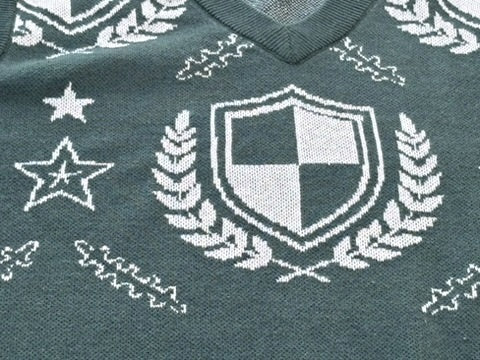Hunter Green Crest sweater vest V-neck with the cream shield, laurel and star pattern