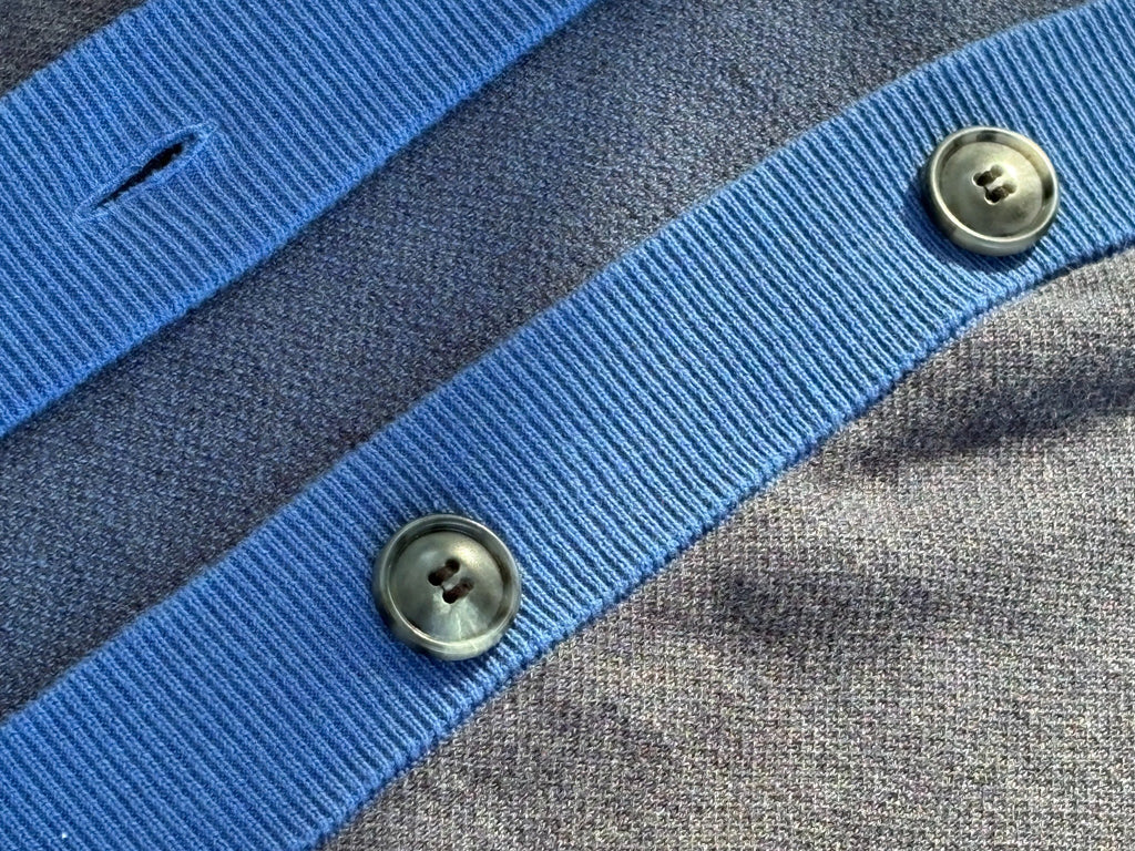 Close view of Public Prep navy and collegiate blue cardigan showing ribbed trim, buttons, and knit texture