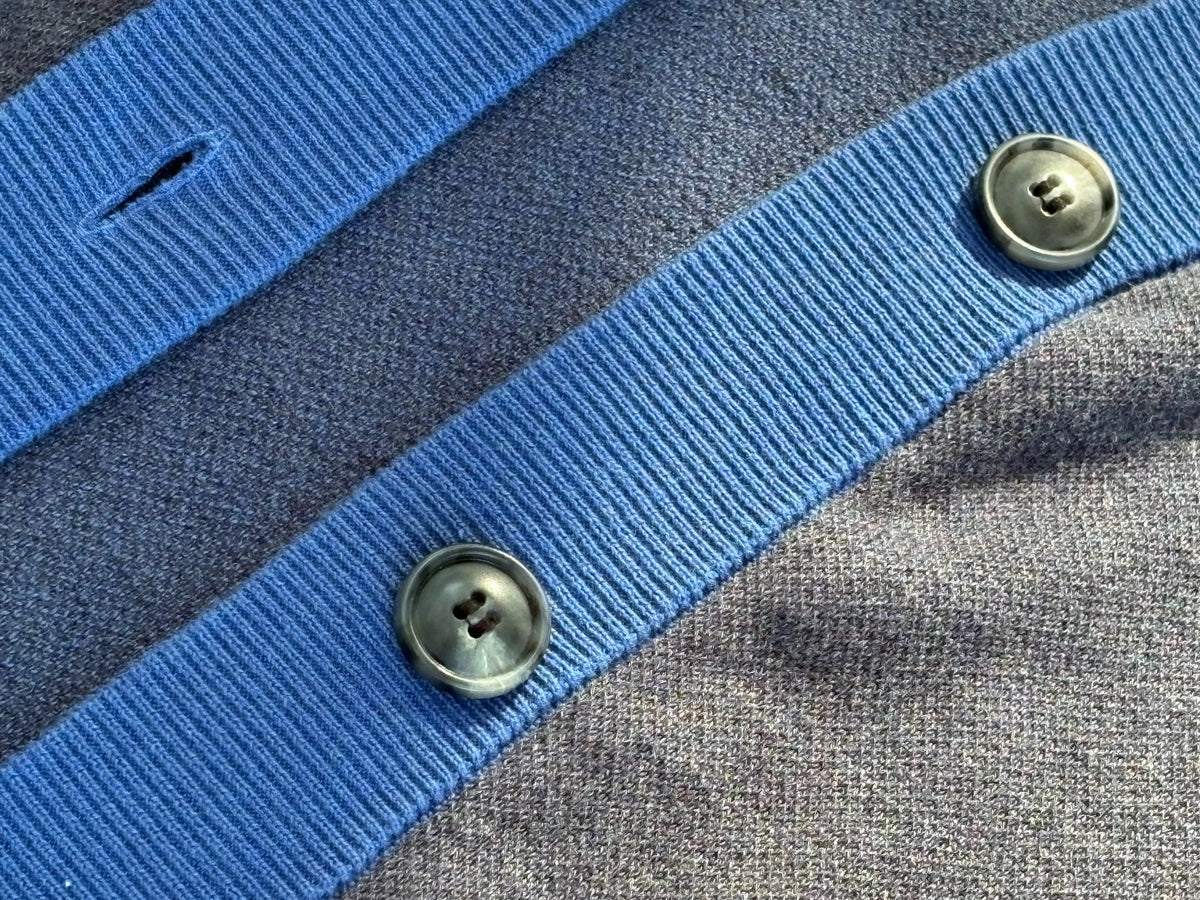 Close view of Public Prep navy and collegiate blue cardigan showing ribbed trim, buttons, and knit texture