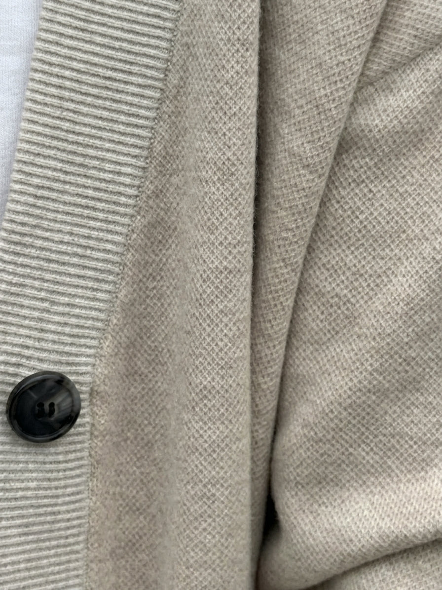 Sand & Ivory cardigan button placket with ribbed trim and a dark horn-look button