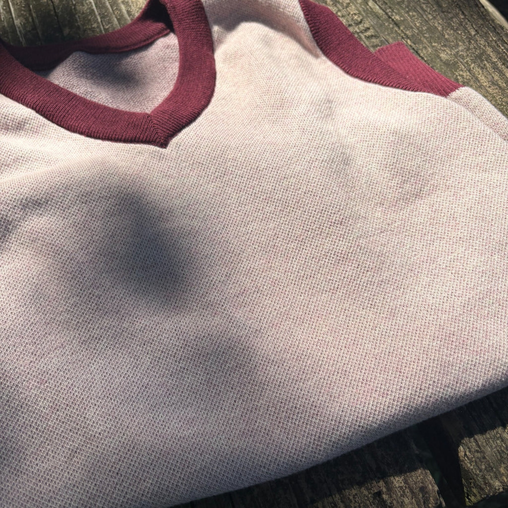 Public Prep Strawberry & Plum sweater vest shown in natural light with V-neck and contrast trim