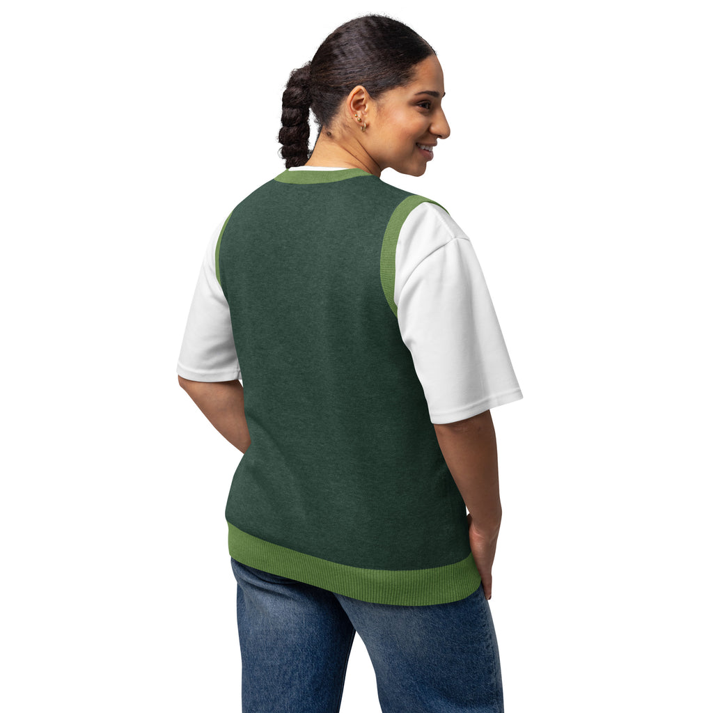 Model wearing unisex knit vest paired with denim jeans