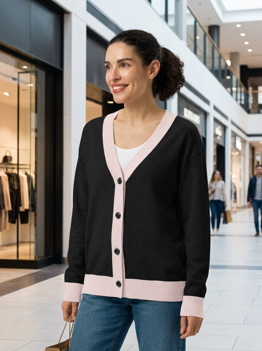 Model wearing Public Prep Classic Knitted Cardigan in Black & Pink at a shopping mall